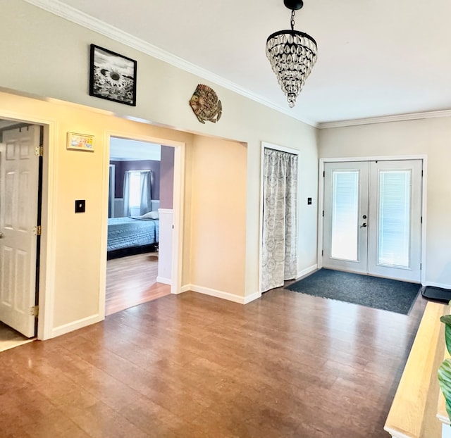 106 Magnolia St, Athens, PA 18810 - entrance foyer featuring dark wood-type flooring, crown molding, french doors, and plenty of natural light