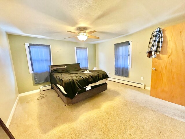 interior space featuring a baseboard radiator, ceiling fan, a textured ceiling, and a closet