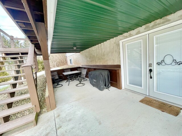 snowy yard with a storage shed