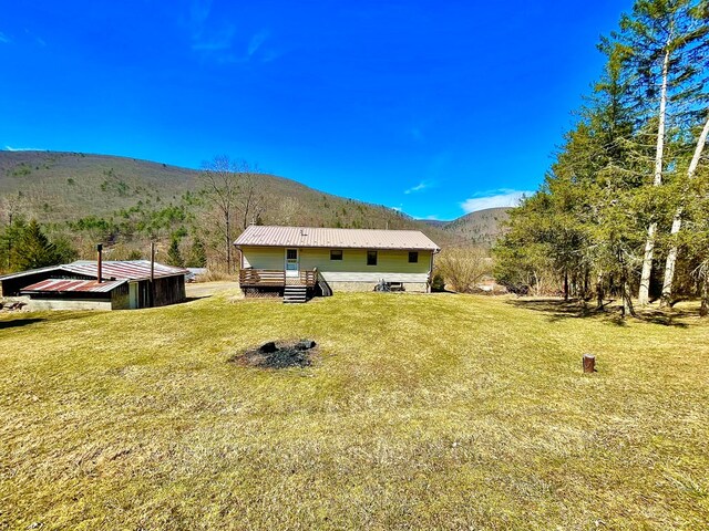 view of yard with a wooden deck