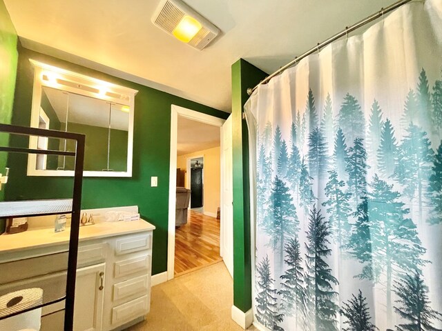 exercise area with french doors, light colored carpet, and a baseboard radiator