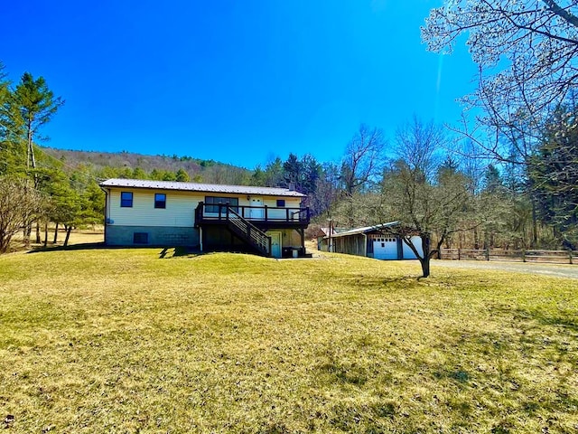 38 Elmers Ln, Wellsboro, PA 16901 - back of house with an outdoor structure, stairway, a wooden deck, metal roof, and a yard