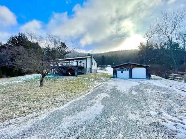 exterior space with an outbuilding and a garage