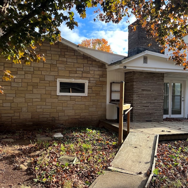 view of side of home with a deck