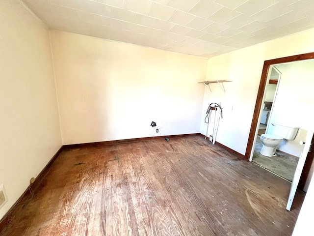 clothes washing area featuring wood-type flooring