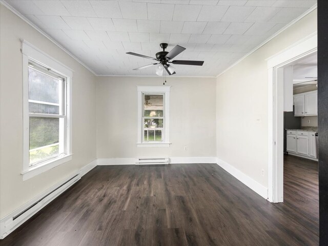 unfurnished room with ornamental molding and a baseboard heating unit