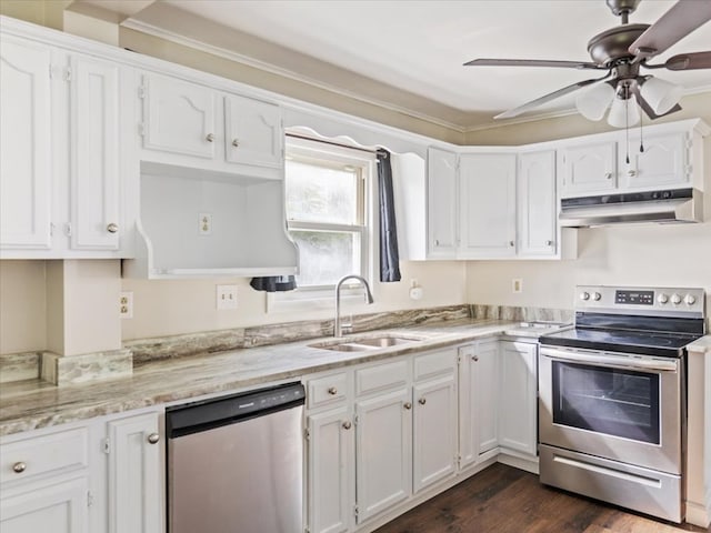 kitchen with white cabinets, sink, ceiling fan, dark hardwood / wood-style flooring, and stainless steel appliances