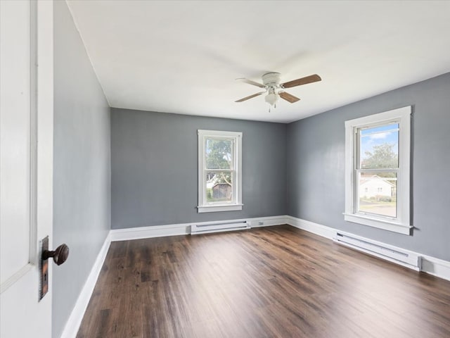 empty room with a baseboard radiator, dark hardwood / wood-style floors, and ceiling fan