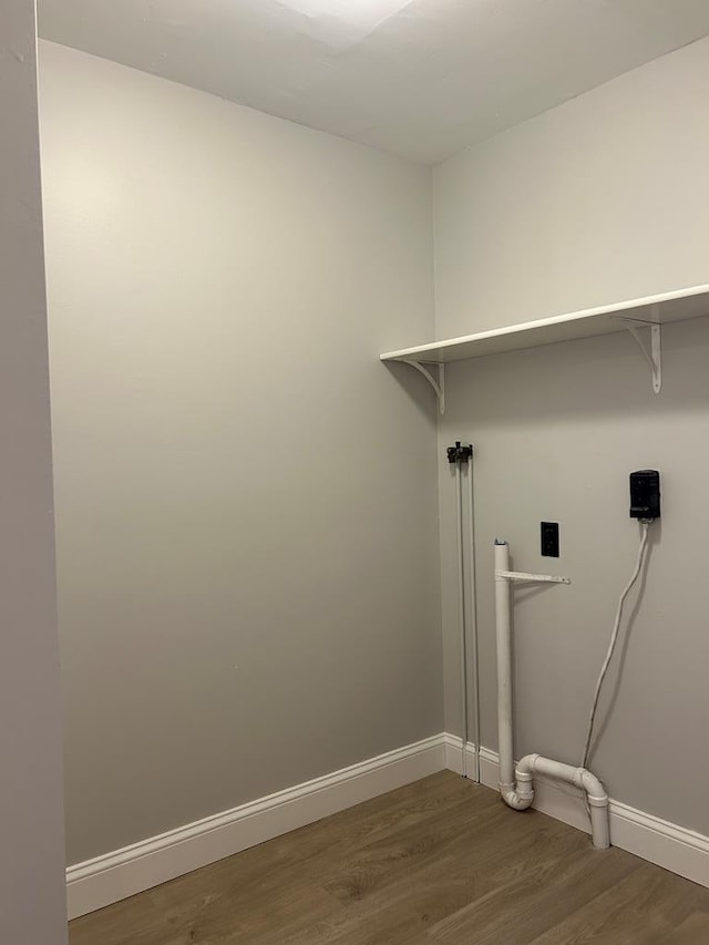 342 Smoke Rise Rd, Mansfield, PA 16933 - laundry room featuring wood finished floors and baseboards