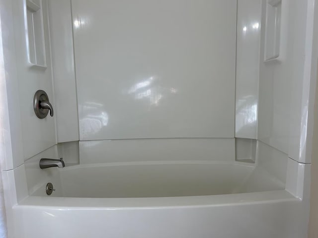 bathroom with shower / washtub combination