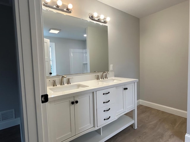 342 Smoke Rise Rd, Mansfield, PA 16933 - full bathroom featuring wood finished floors and double vanity