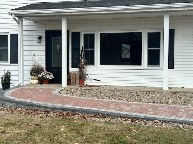 342 Smoke Rise Rd, Mansfield, PA 16933 - doorway to property with a shingled roof and covered porch