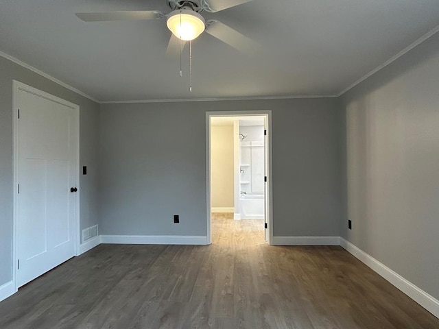 unfurnished room featuring crown molding, dark hardwood / wood-style flooring, and ceiling fan