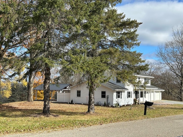 view of front facade with a garage and a front lawn