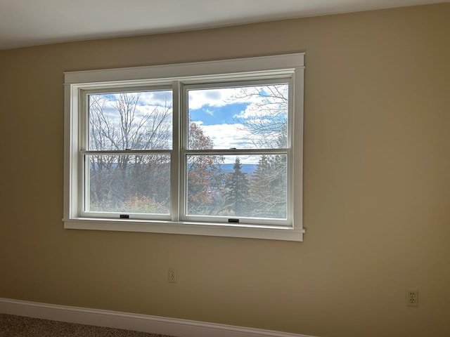 spare room featuring carpet flooring