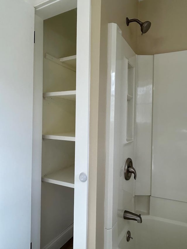 bathroom featuring shower / washtub combination