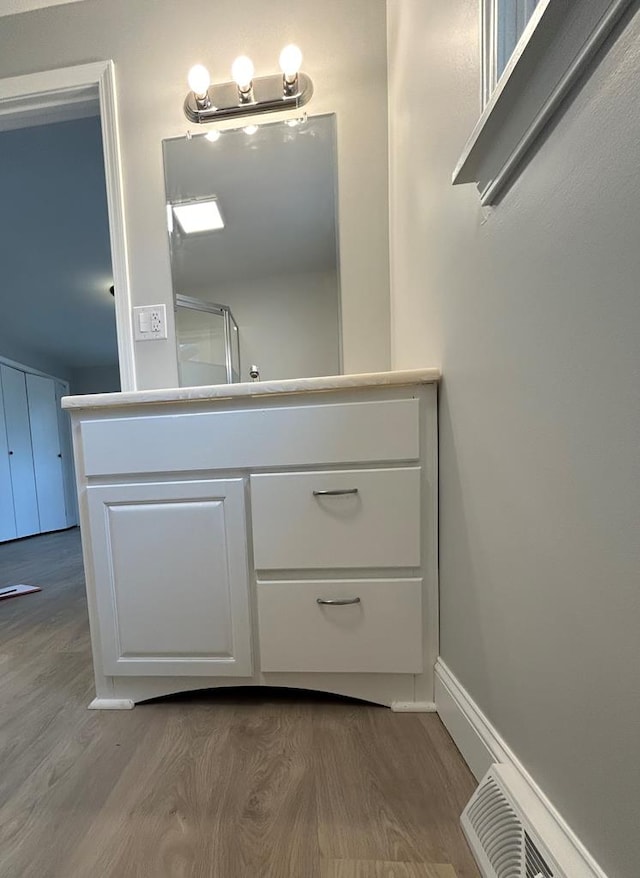 342 Smoke Rise Rd, Mansfield, PA 16933 - bathroom with wood finished floors, vanity, and a shower with shower door
