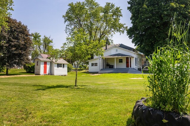 213 Holden St, Osceola, PA 16942 - back of property with a porch, a lawn, and an outdoor structure