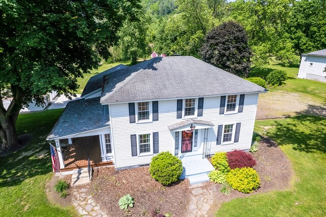213 Holden St, Osceola, PA 16942 - colonial inspired home featuring a front yard, a shingled roof, and covered porch
