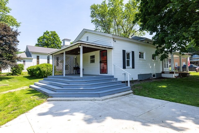 213 Holden St, Osceola, PA 16942 - view of front of house featuring covered porch and a front lawn