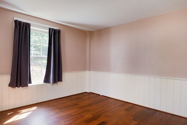 213 Holden St, Osceola, PA 16942 - spare room featuring wood finished floors and wainscoting