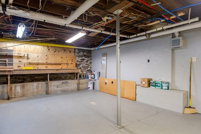 213 Holden St, Osceola, PA 16942 - unfinished below grade area featuring a workshop area