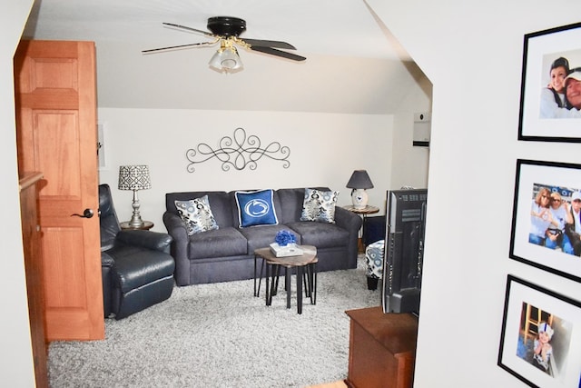 carpeted living room featuring ceiling fan