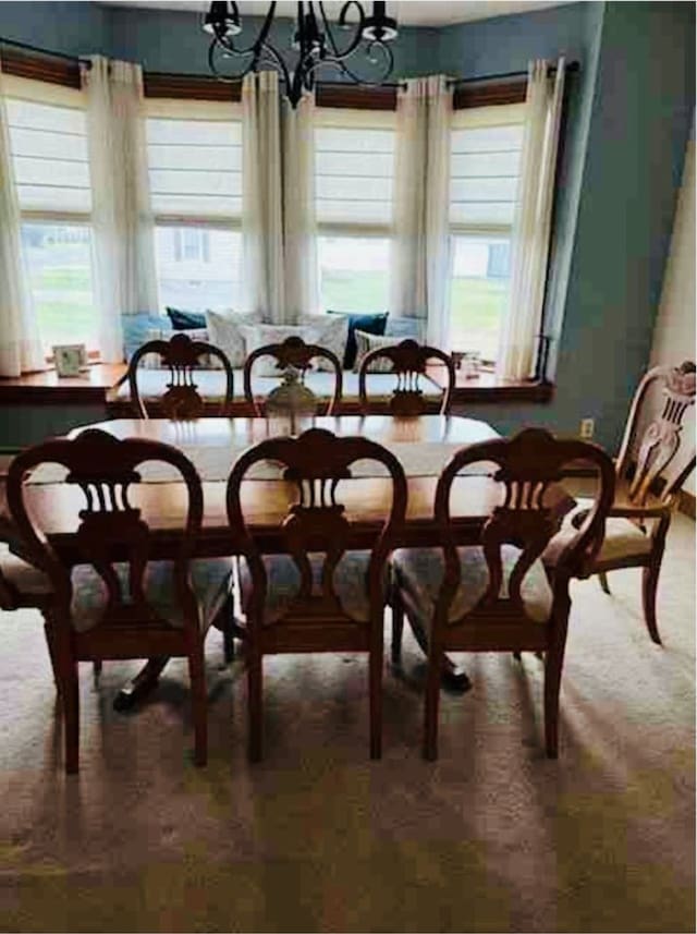 dining space with a notable chandelier