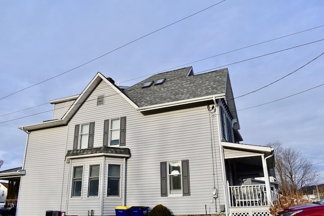 view of property exterior featuring a porch