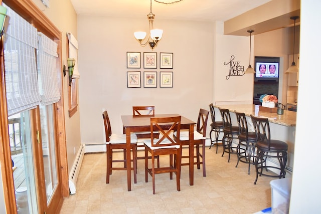 dining space with a baseboard heating unit and a chandelier