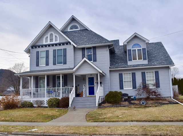 view of front of house with a front lawn and a porch