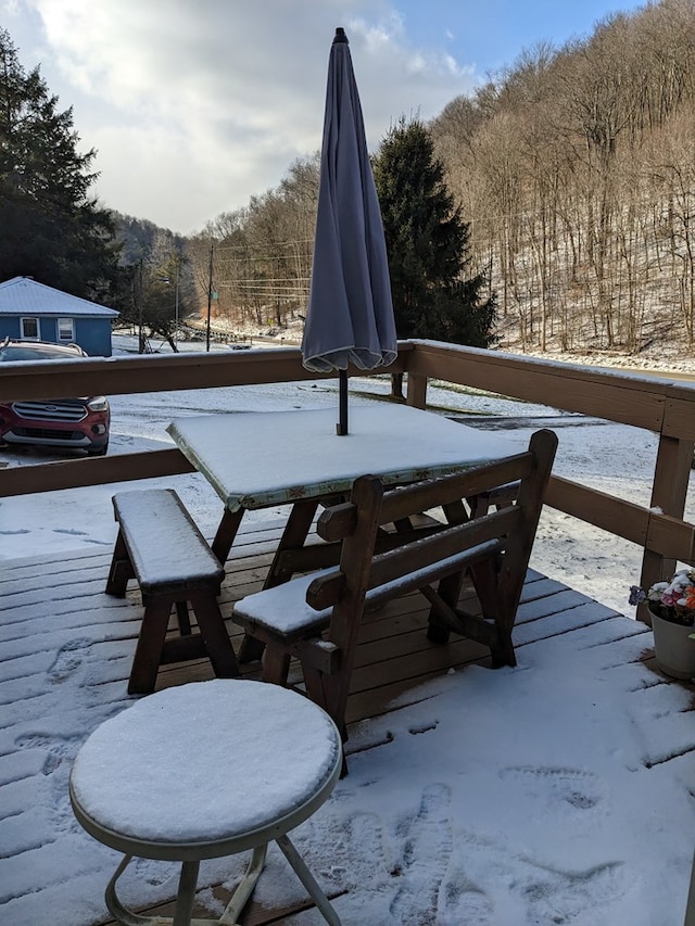 view of snow covered deck