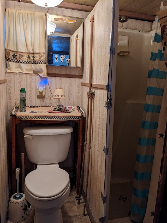 bathroom with toilet, wood ceiling, and walk in shower