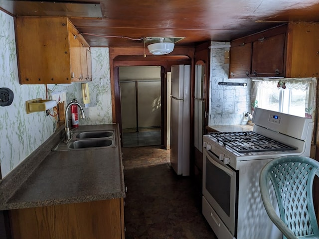 kitchen with sink, fridge, and gas range