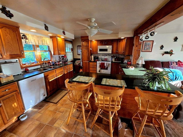 16 Evergreen Dr, Tunkhannock, PA 12155 - kitchen with white appliances, a sink, a ceiling fan, and dark countertops