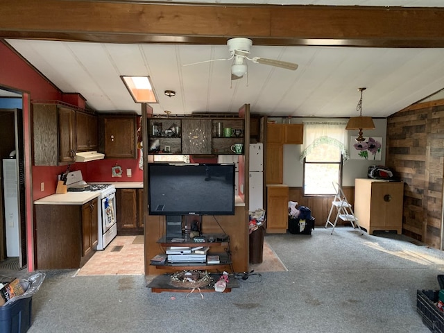 kitchen with ceiling fan, range hood, white range oven, decorative light fixtures, and lofted ceiling