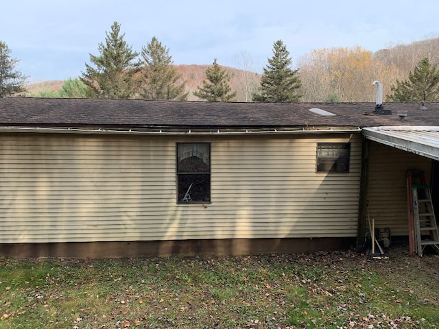 view of side of property with a mountain view