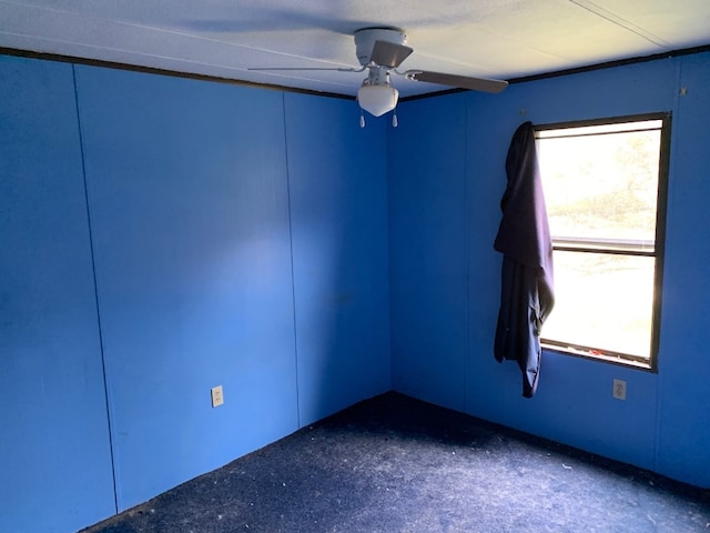 unfurnished room with ceiling fan