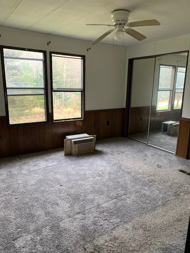 unfurnished bedroom featuring multiple windows, a closet, and ceiling fan