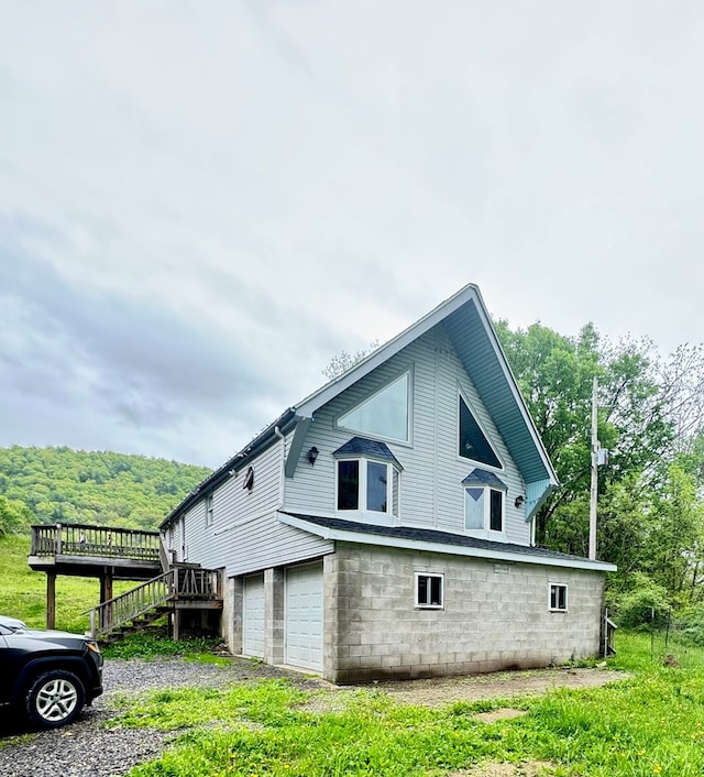 8380 Sheshequin Rd, Athens, PA 18810 - view of side of home featuring a wooden deck, an attached garage, and stairs