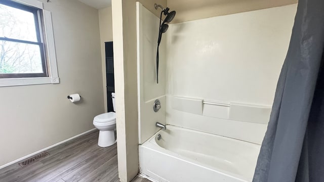 8380 Sheshequin Rd, Athens, PA 18810 - bathroom with wood finished floors, toilet, baseboards, and bathing tub / shower combination