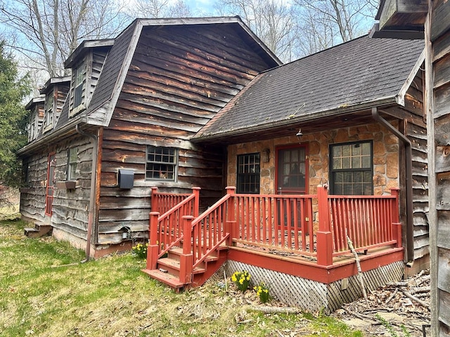 back of property with stone siding