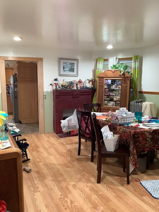 dining space with light wood-type flooring