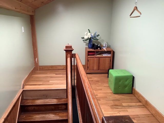 stairs featuring hardwood / wood-style flooring