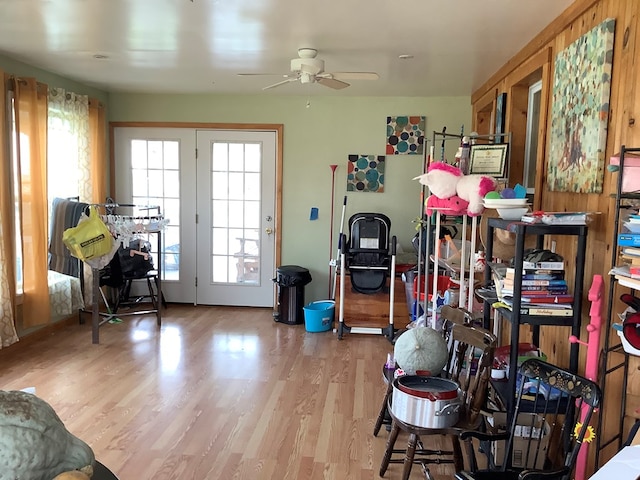 miscellaneous room with ceiling fan and light wood-type flooring