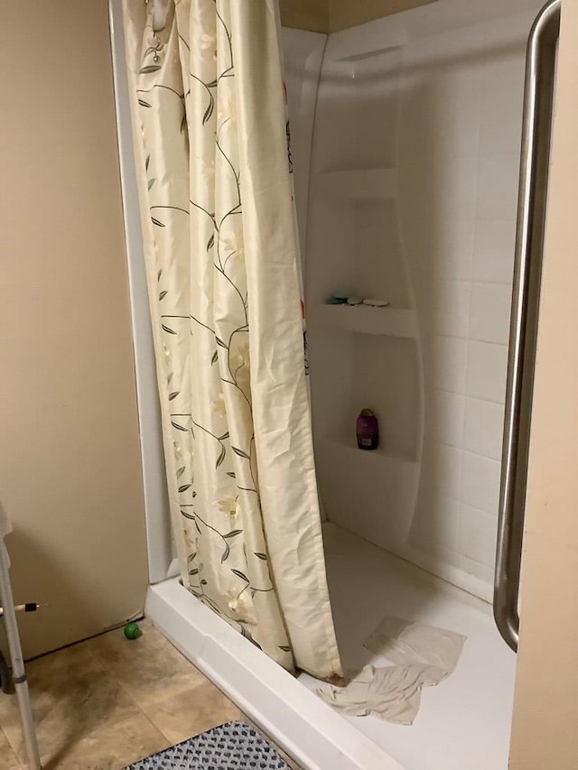 bathroom with a shower with shower curtain