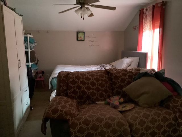 bedroom featuring ceiling fan and vaulted ceiling