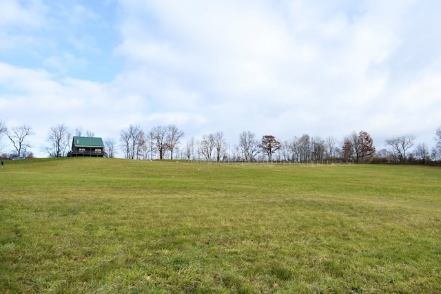 view of yard with a rural view