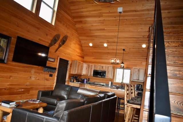 living room with wood walls and high vaulted ceiling