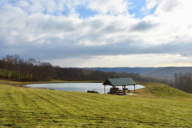 view of water feature with a gazebo and a mountain view